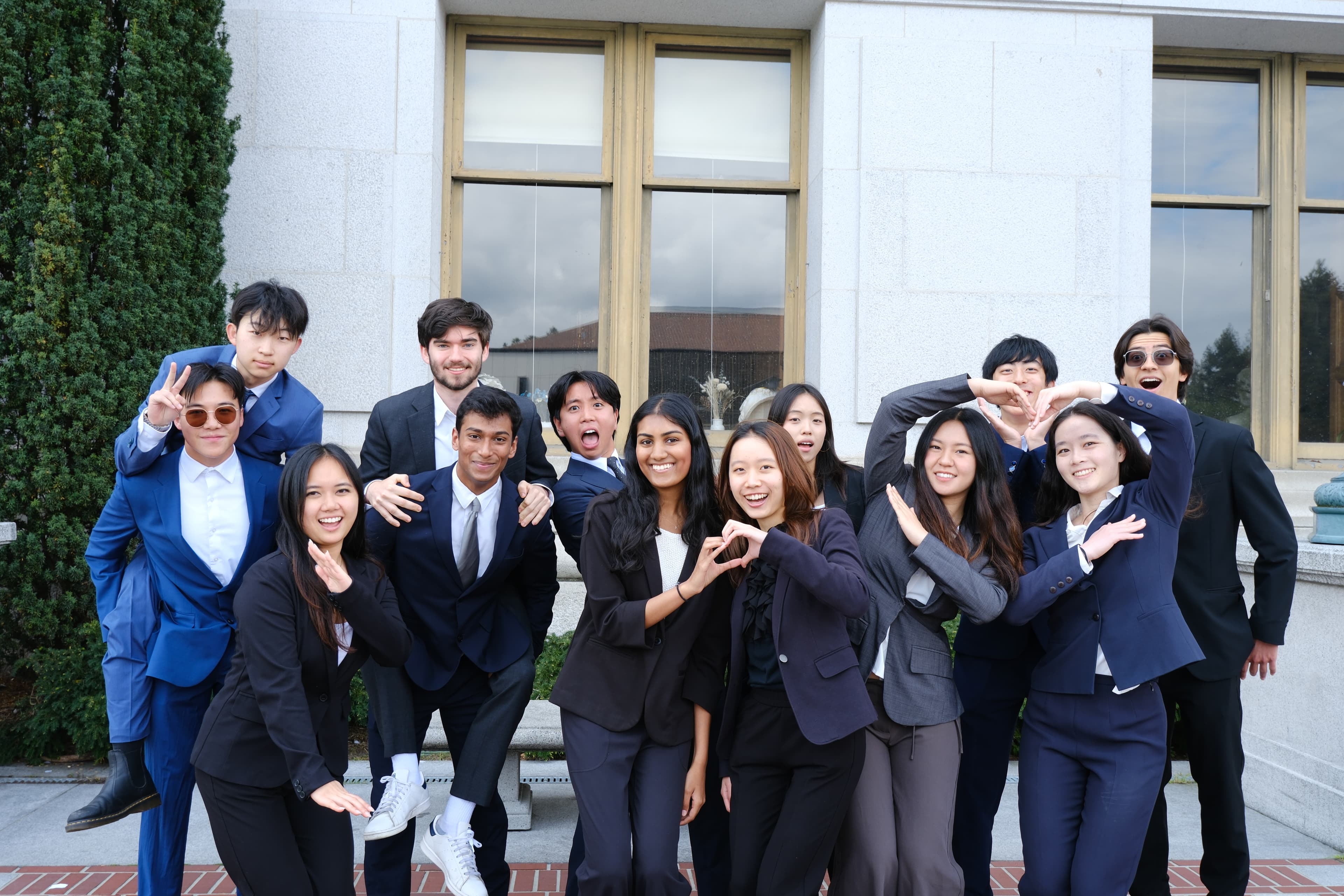 Consulting committee members posing together outside a UC Berkeley campus building